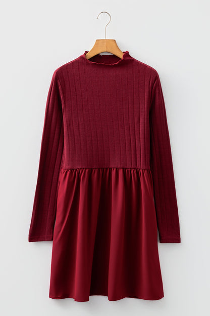 Byzantium Bay ribbed knit patchwork long sleeve dress featuring a fitted silhouette and textured fabric in a stylish design.