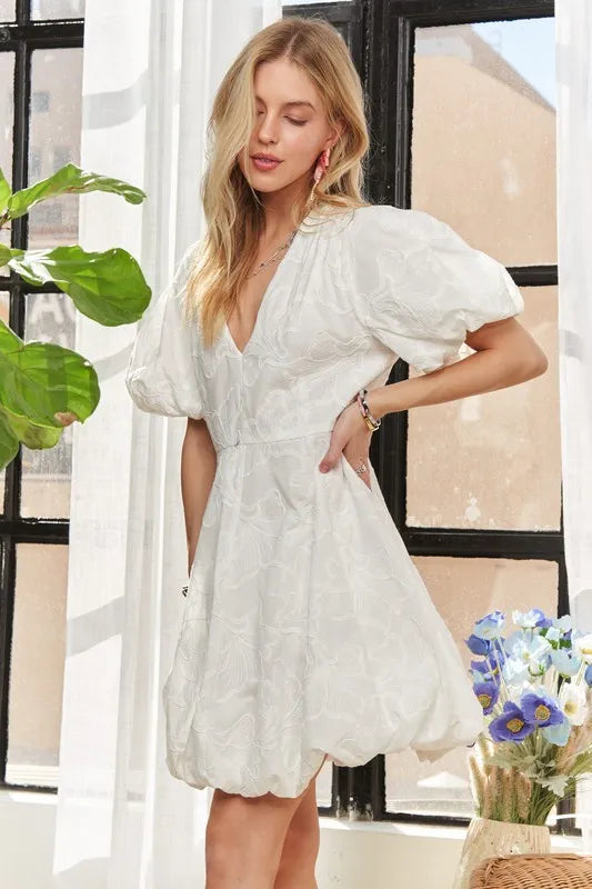 Pear Daisy ADORA puff sleeve floral dress with a fitted bodice and flowy skirt, perfect for garden parties and outdoor events.