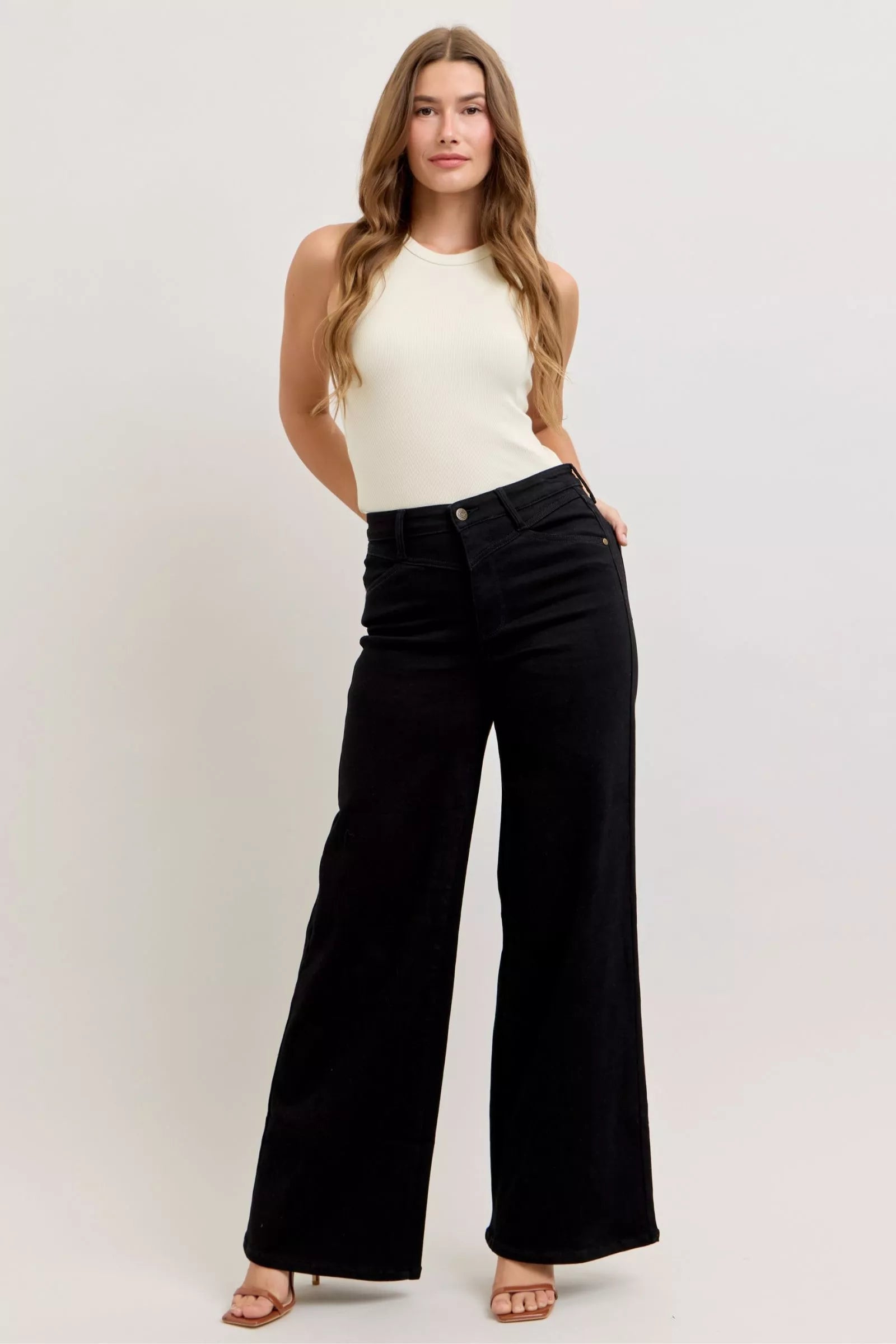 Pear Daisy Judy Blue high-waisted wide-leg jeans, showcasing denim fabric and stylish fit in a home and garden styled setting.