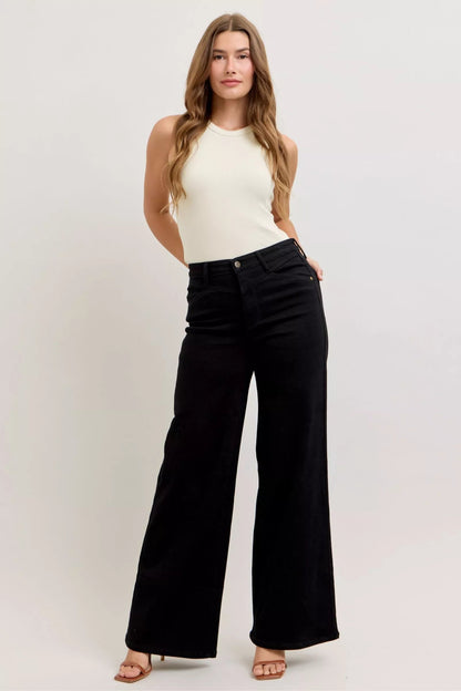 Pear Daisy Judy Blue high-waisted wide-leg jeans, showcasing denim fabric and stylish fit in a home and garden styled setting.
