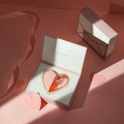 Carmine Juneberry First Love Paris bodycare bottle with elegant design, showcasing the scent of a first glance in a sleek container