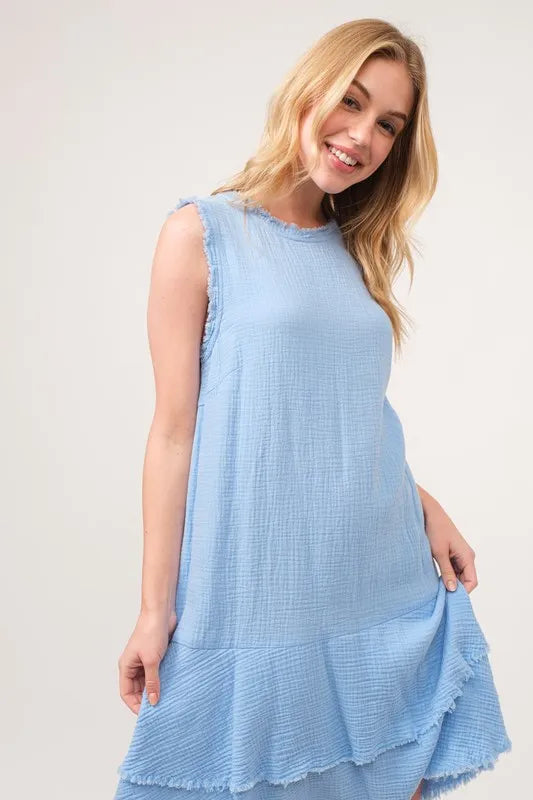 Jade Icarus washed fringe detail tiered dress with layered fabric and boho style, displayed on a hanger against a neutral background.