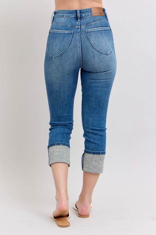 Judy Blue plus size skinny cuff capris jeans with pockets, shown in full length on a woman, from Jade Icarus women&