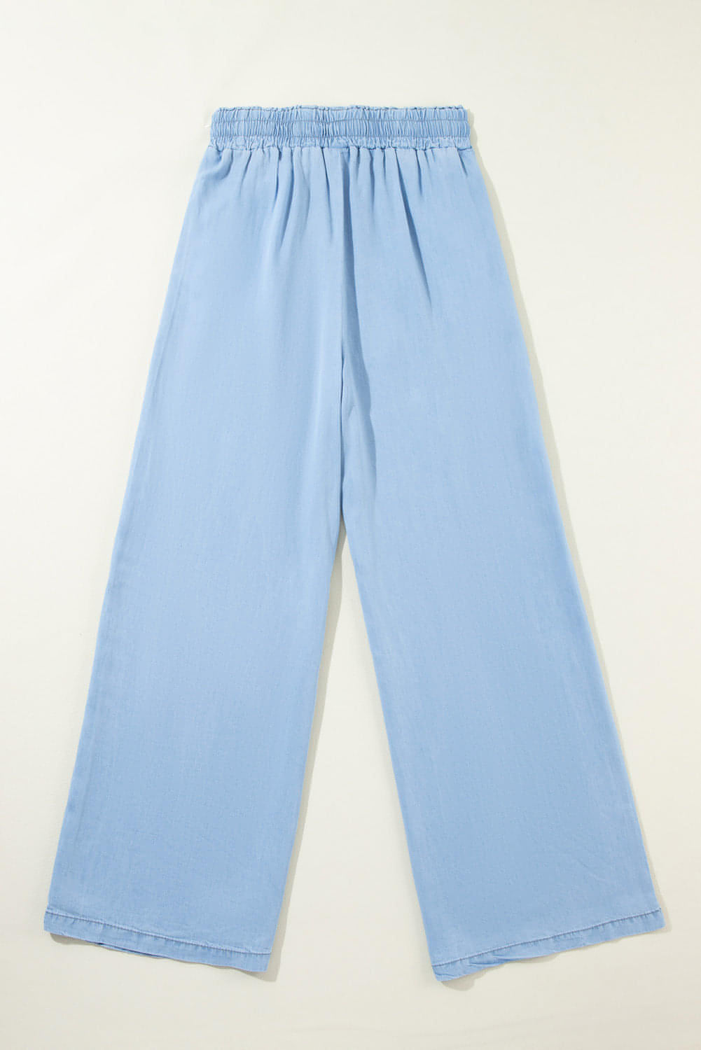 Carmine Juneberry Myosotis high-waist wide-leg denim pants with drawstring waist and classic blue denim fabric.