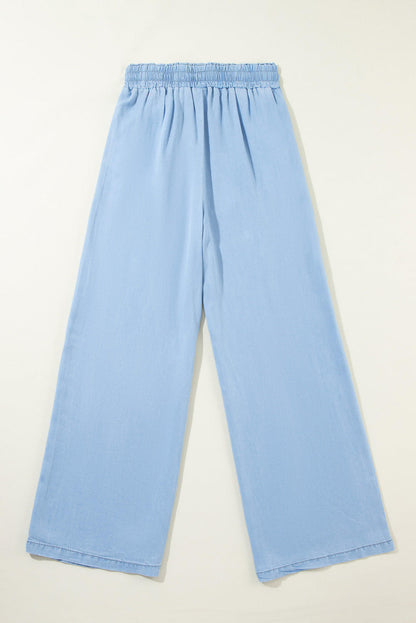 Carmine Juneberry Myosotis high-waist wide-leg denim pants with drawstring waist and classic blue denim fabric.