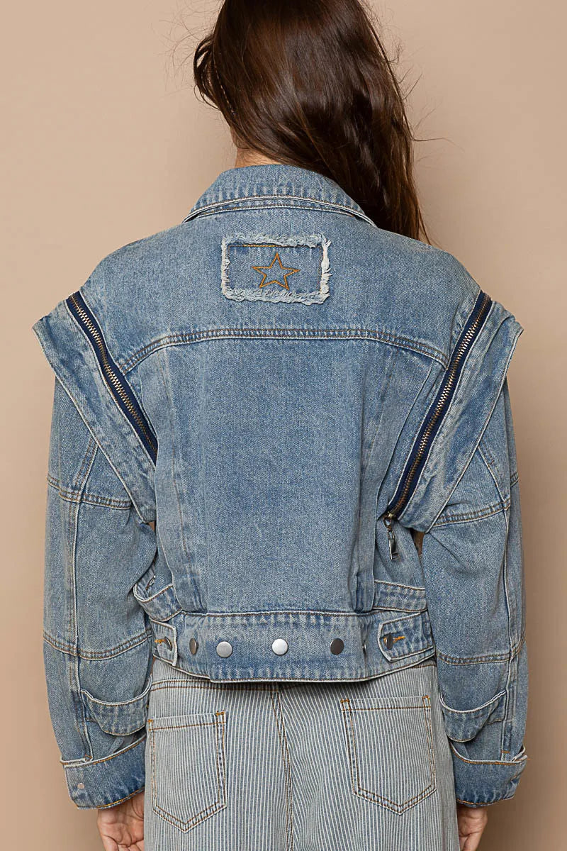 Pear Daisy POL cropped denim jacket with functional zipper detail, casual style, classic blue wash, shown on a hanger.