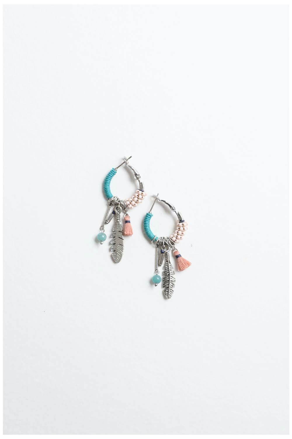 Dainty feather hoop earrings by Periwinkle Aether featuring fringe design and delicate craftsmanship, perfect for accessories.