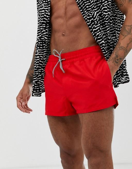Dark red Sky Felix swim shorts with elastic waistband and side pockets, suitable for beach or poolside wear.