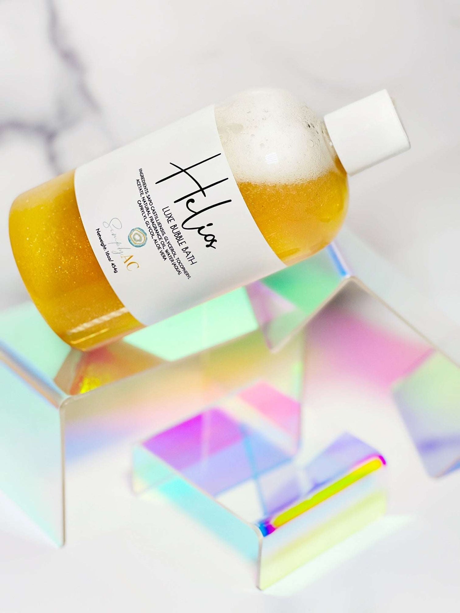 Orchid Hyperion Helios Luxe Bubble Bath bottle with elegant label, showcasing luxurious bodycare product in a clear, minimalist setting