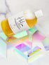 Orchid Hyperion Helios Luxe Bubble Bath bottle with elegant label, showcasing luxurious bodycare product in a clear, minimalist setting
