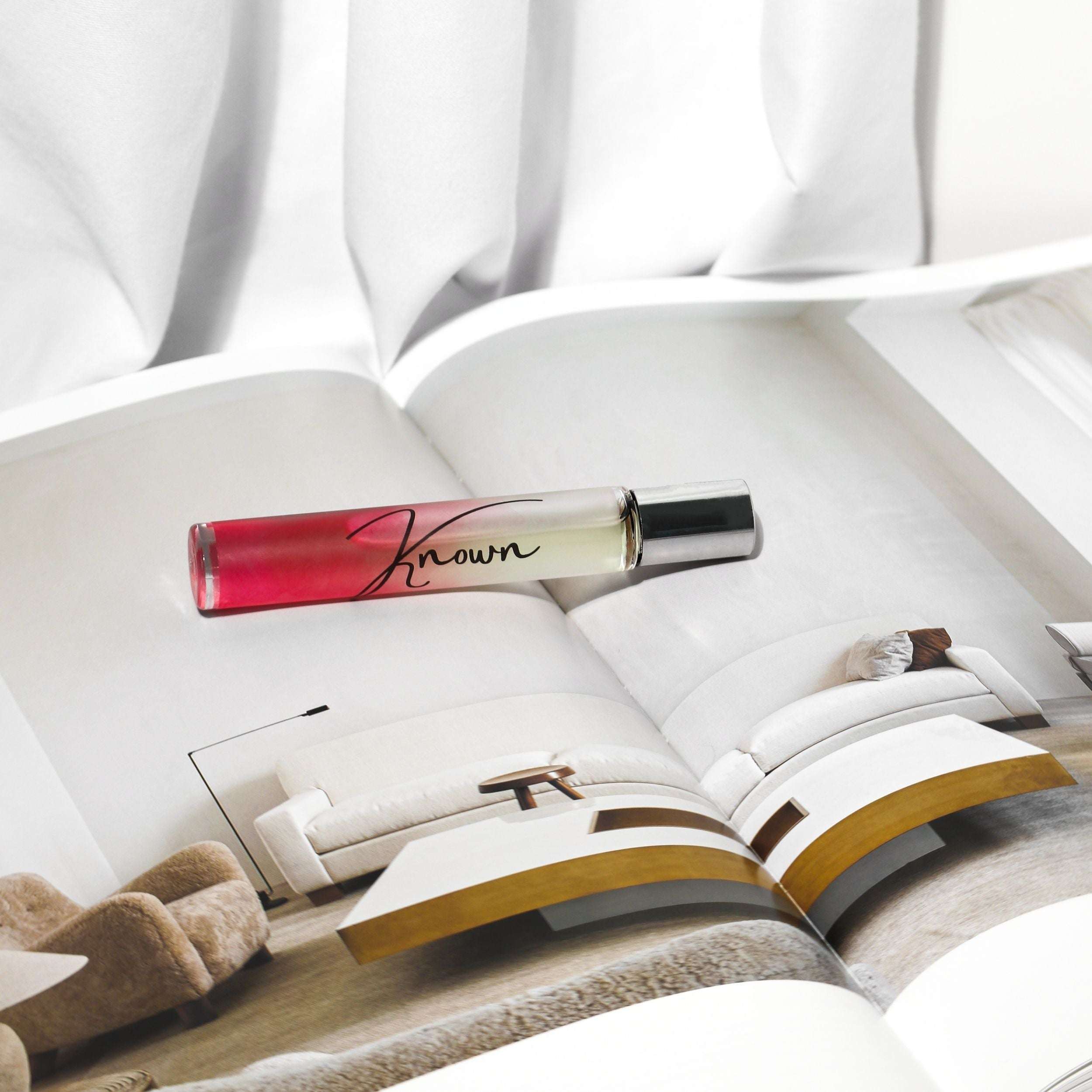 Plum Beech Known rollerball perfume in a sleek glass bottle, perfect for on-the-go fragrance in the Bath &amp; Beauty collection.