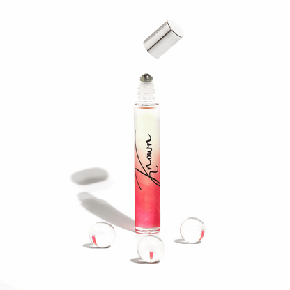Plum Beech Known rollerball perfume in a sleek glass bottle, designed for easy application and portable fragrance.