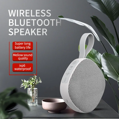 Waterproof Lilac Milo portable mini TWS wireless Bluetooth speaker showing sleek black design and compact size.