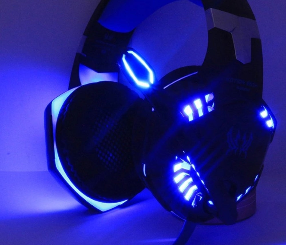 Yellow Pandora Ninja Dragon G9300 LED gaming headset with microphone, black and yellow design, adjustable headband and ear cushions.