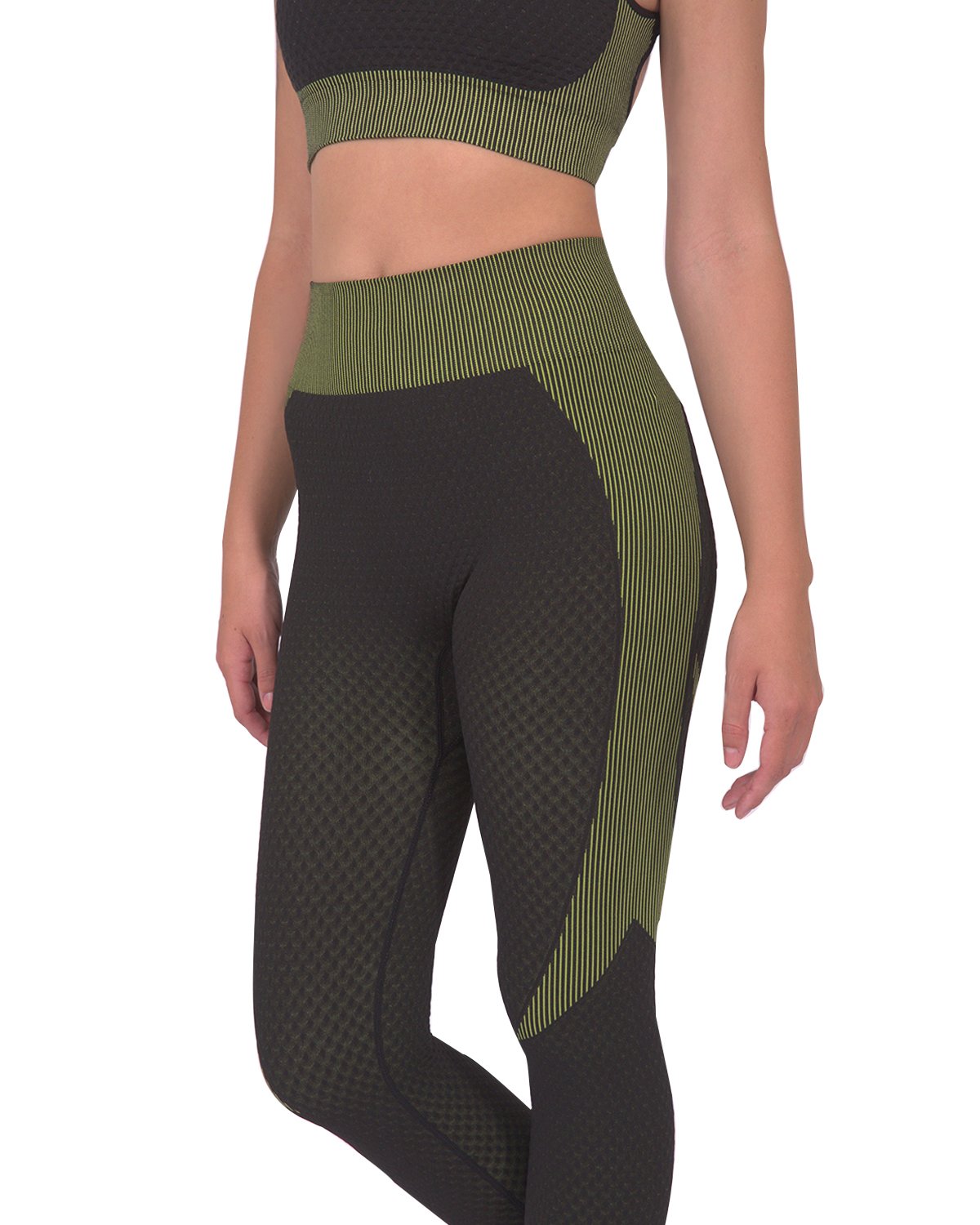 Black Lazurite Trois Seamless Legging with green accents, designed for activewear, shown on a model.