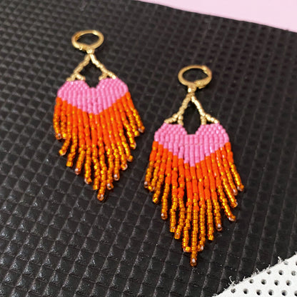 Yellow Athena LOVE earrings with pink and orange ombre fringe, featuring dangling colorful tassels and unique jewelry design.