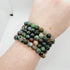 Colorful agate stone bracelets by Olive Coeus featuring semi-precious stones and Reiki healing properties, displayed on a neutral background.