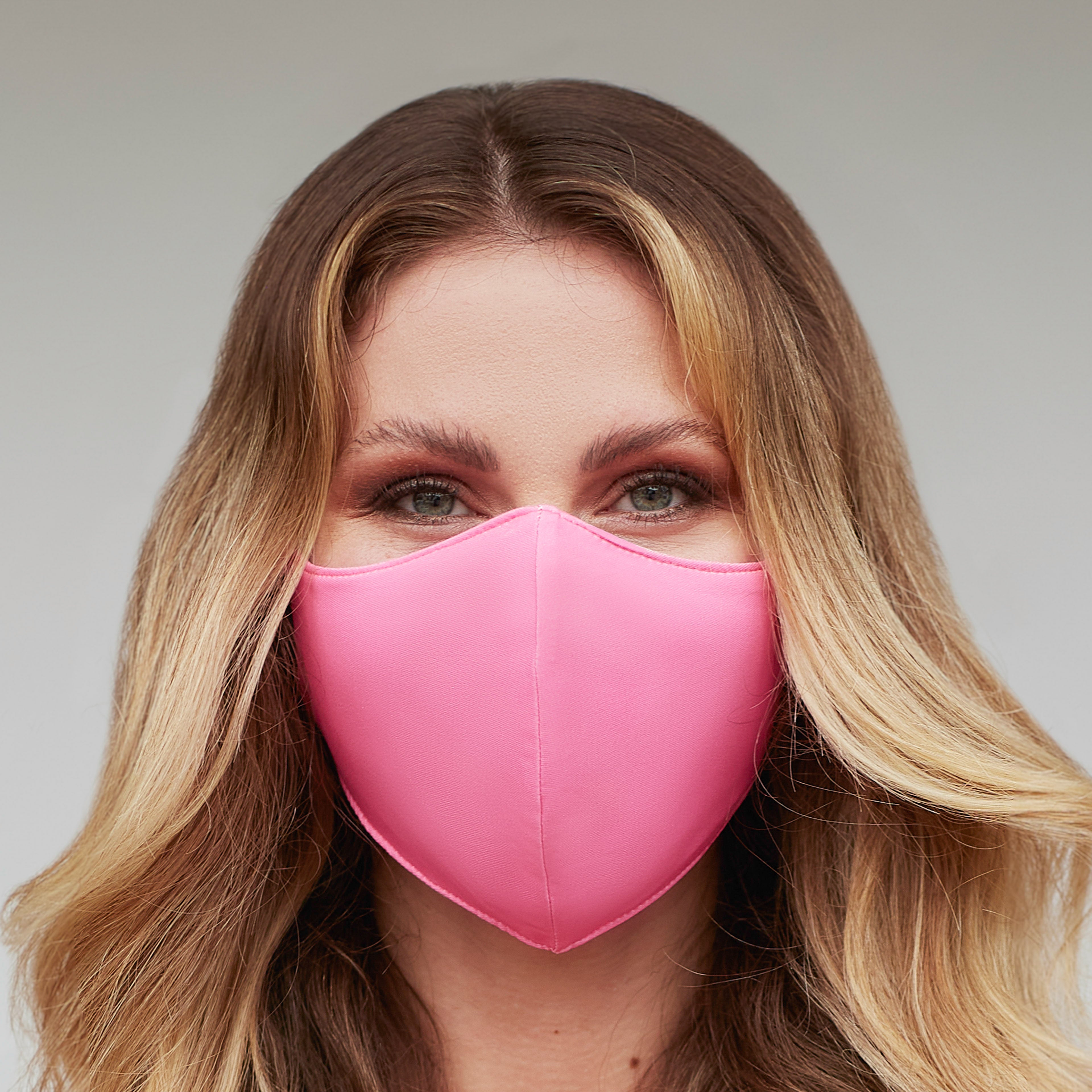 Pink face mask for women with solid charity design by Cyan Poppy, featuring soft fabric and comfortable fit.