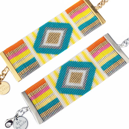 Colorful Rainbow Bracelet by Yellow Athena featuring vibrant rainbow beads and adjustable cord for a stylish accessory.
