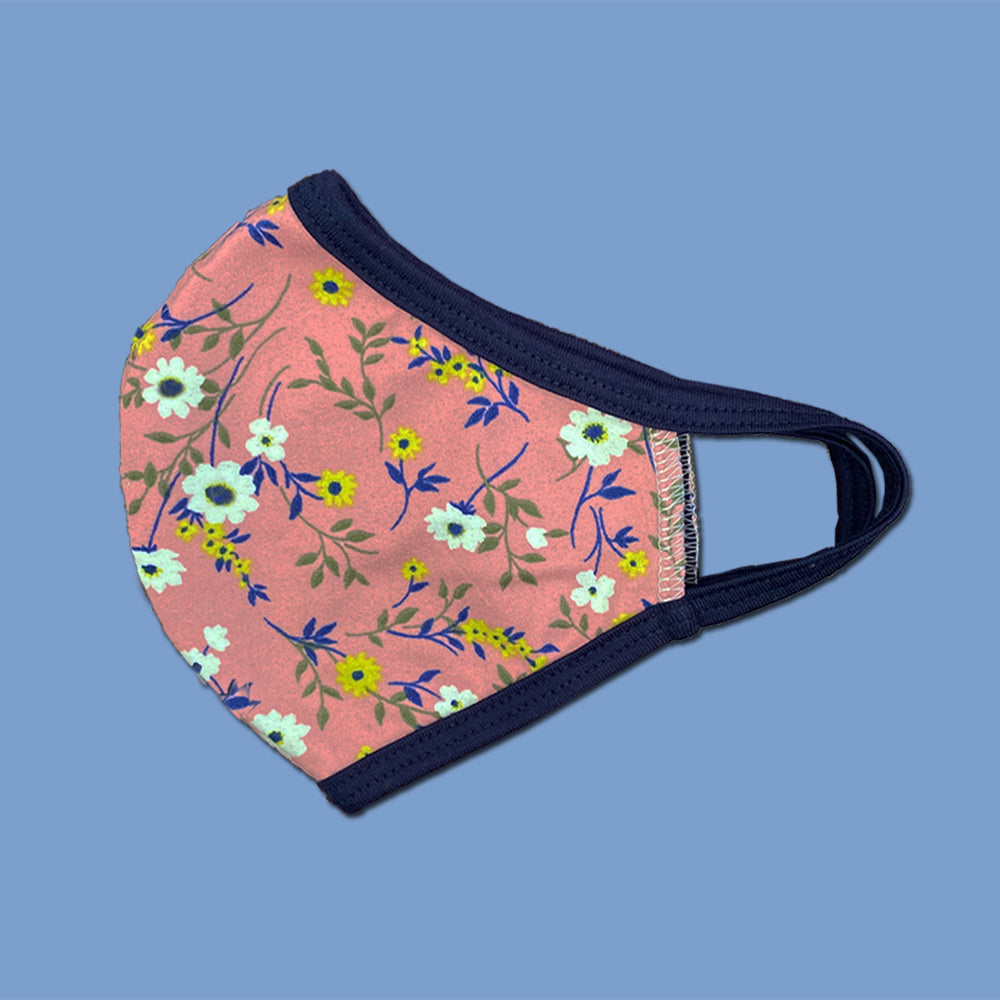 Reusable floral face mask by Indigo Arrowwood, washable scarf with colorful flower print, designed for comfort and style.