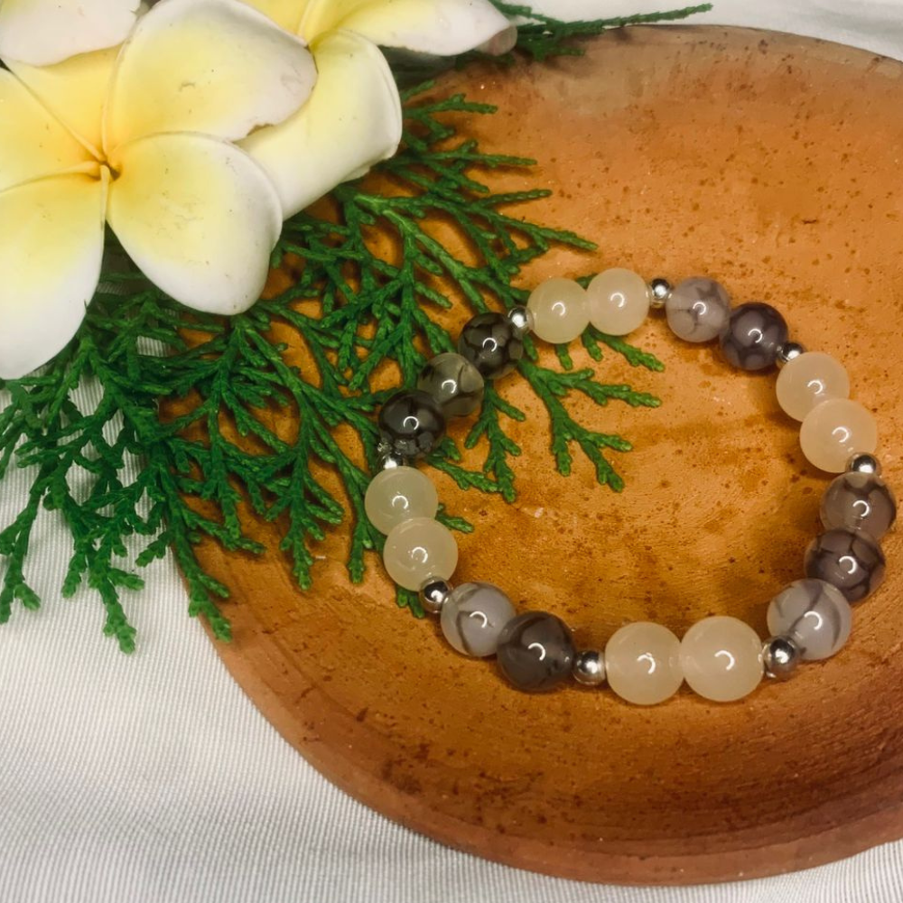 Gray and white agate gemstone beaded bracelet with silver spacer beads, crafted by Tan Saffron.