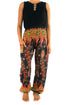 Black peacock boho gypsy pants by Tan Smokey featuring flowing fabric and intricate feather-inspired patterns.