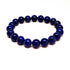 Blue Winterberry lapidary beaded bracelet with blue gemstones, showcasing intricate beadwork and vibrant color details.