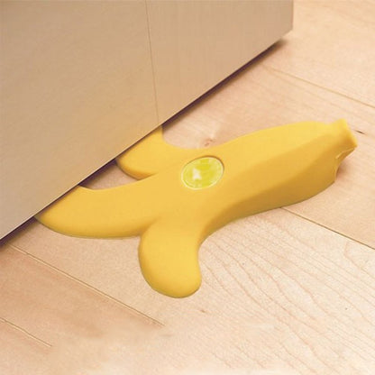 Fuchsia Molly Banana Doorstop in yellow with a curved shape, designed for home and garden use to hold doors open.