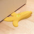 Fuchsia Molly Banana Doorstop in yellow with a curved shape, designed for home and garden use to hold doors open.