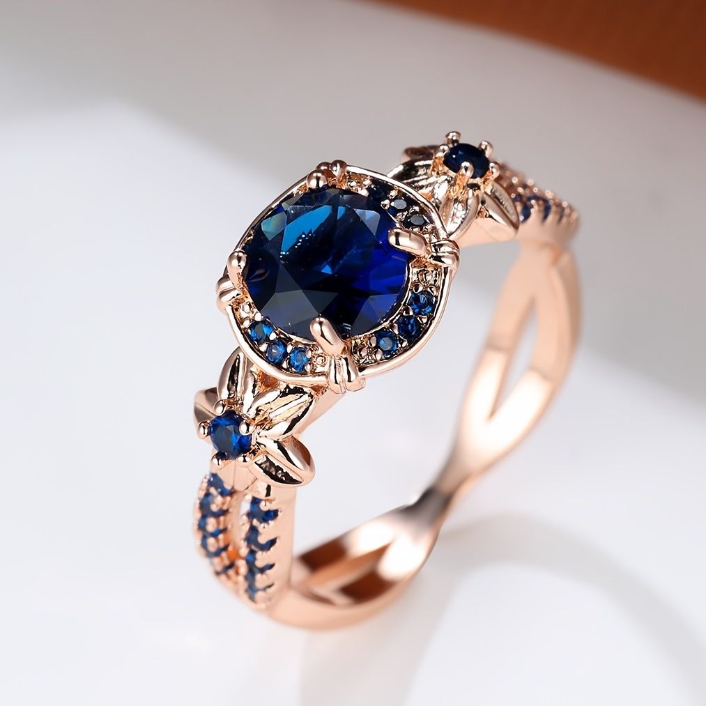 Carmine Medusa sapphire ring featuring a deep blue gemstone set in a detailed silver band.
