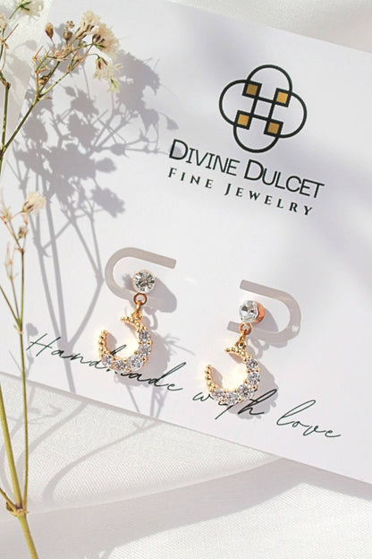 Ultramarine Birch 24 Karat Moon cubic zirconia stud earrings with sparkling moon design and gold-tone finish.
