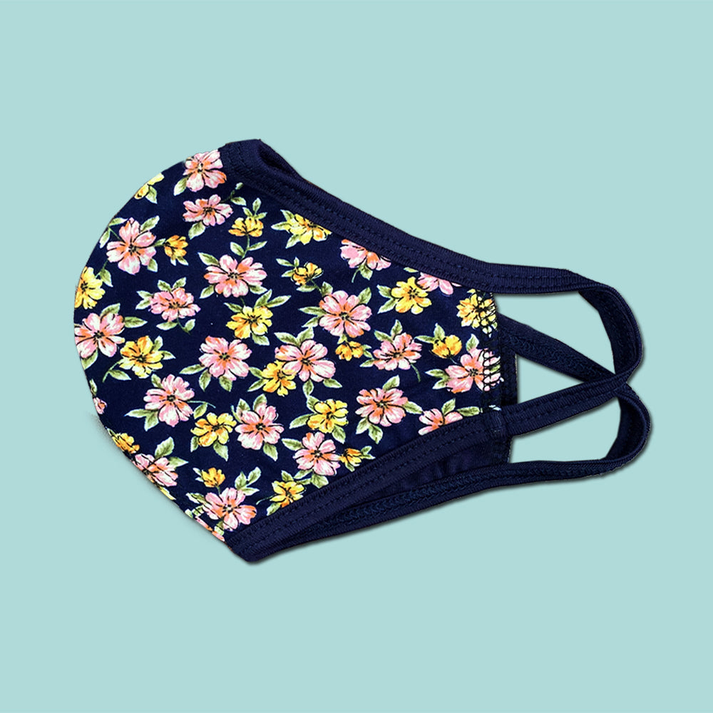 Pack of 25 Indigo Arrowwood floral fabric face masks, washable and reusable, with vibrant floral and scarf-style design.