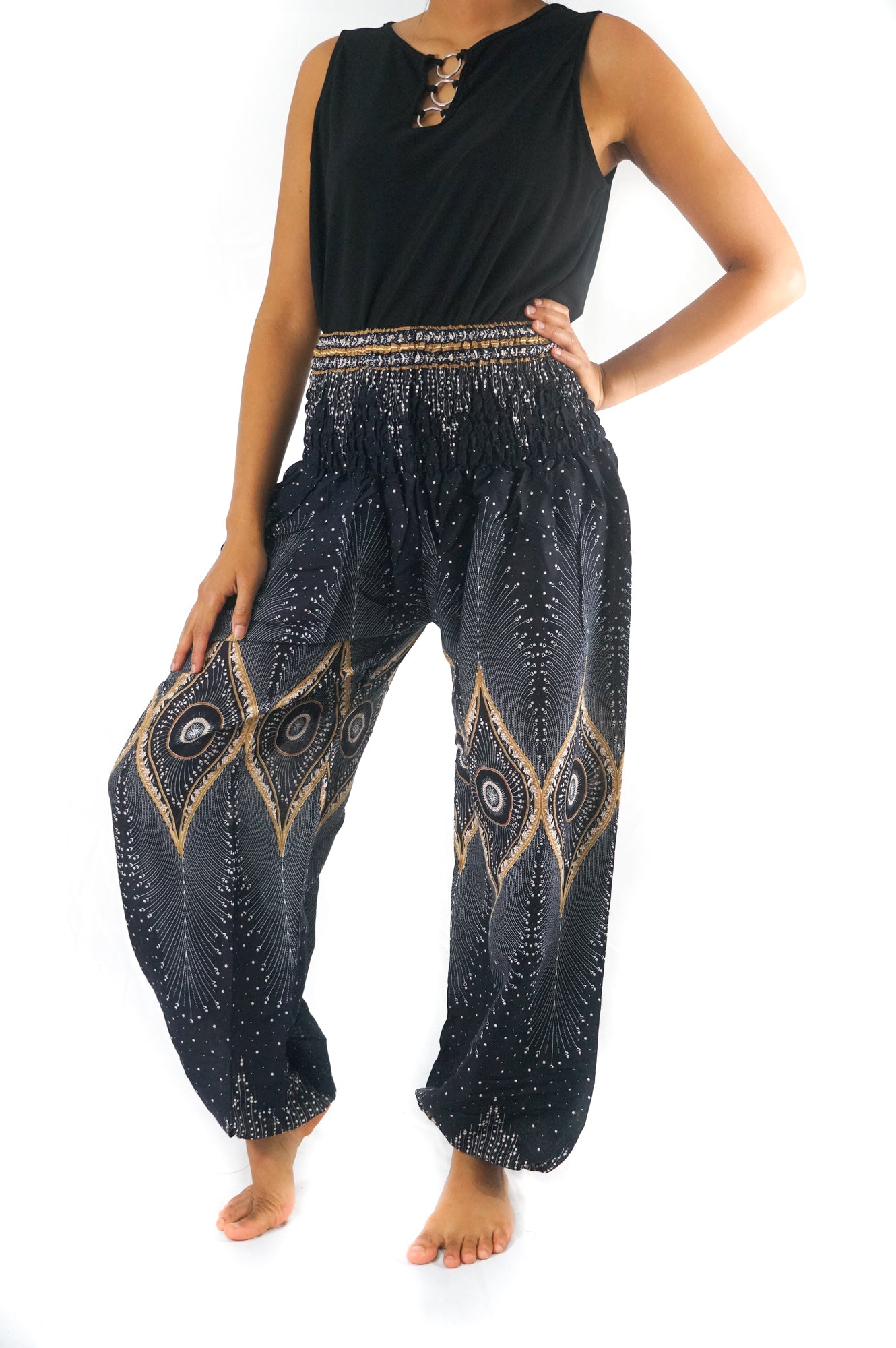 Black PEACOCK Women Boho Pants by Tan Smokey featuring flowy, lightweight hippie yoga pants with peacock print details.