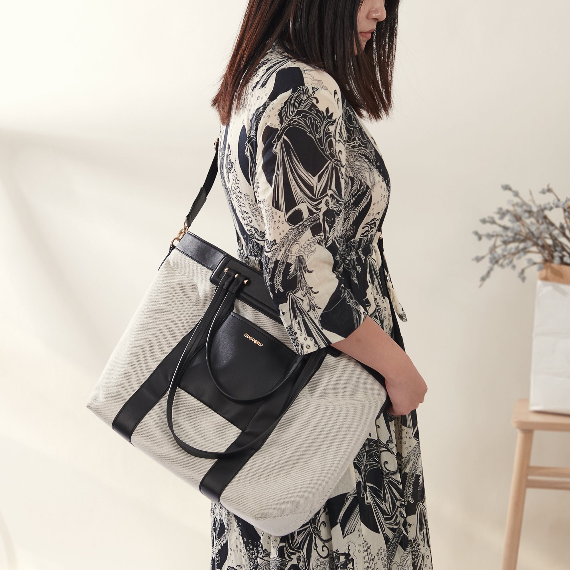 Maroon Chronos Mommy Canvas Diaper Handbag with multiple compartments and adjustable strap, designed for parenthood accessories.