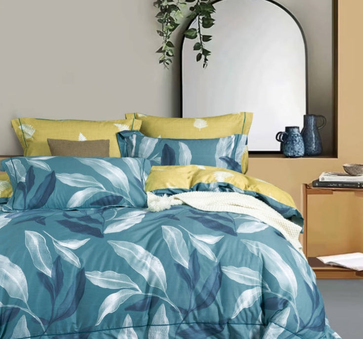 Azure Mango LINNETT blue banana leaves reversible cotton comforter set, soft fabric with tropical leaf pattern on both sides.