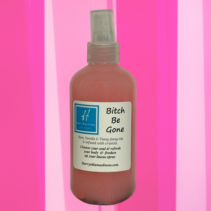 Maroon Blackhaw Body &amp; Linen Spray infused with quartz crystals, featuring a sleek glass bottle and mist spray nozzle.