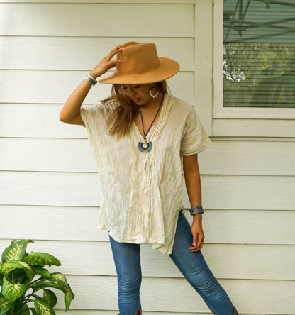 Raw crinkled cotton gauze blouse from Tan Smokey featuring a relaxed fit and lightweight, textured fabric.