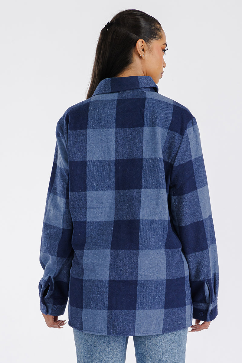 Boyfriend oversized soft flannel shacket by Lime Milo featuring a relaxed fit, button closure, and classic plaid pattern.