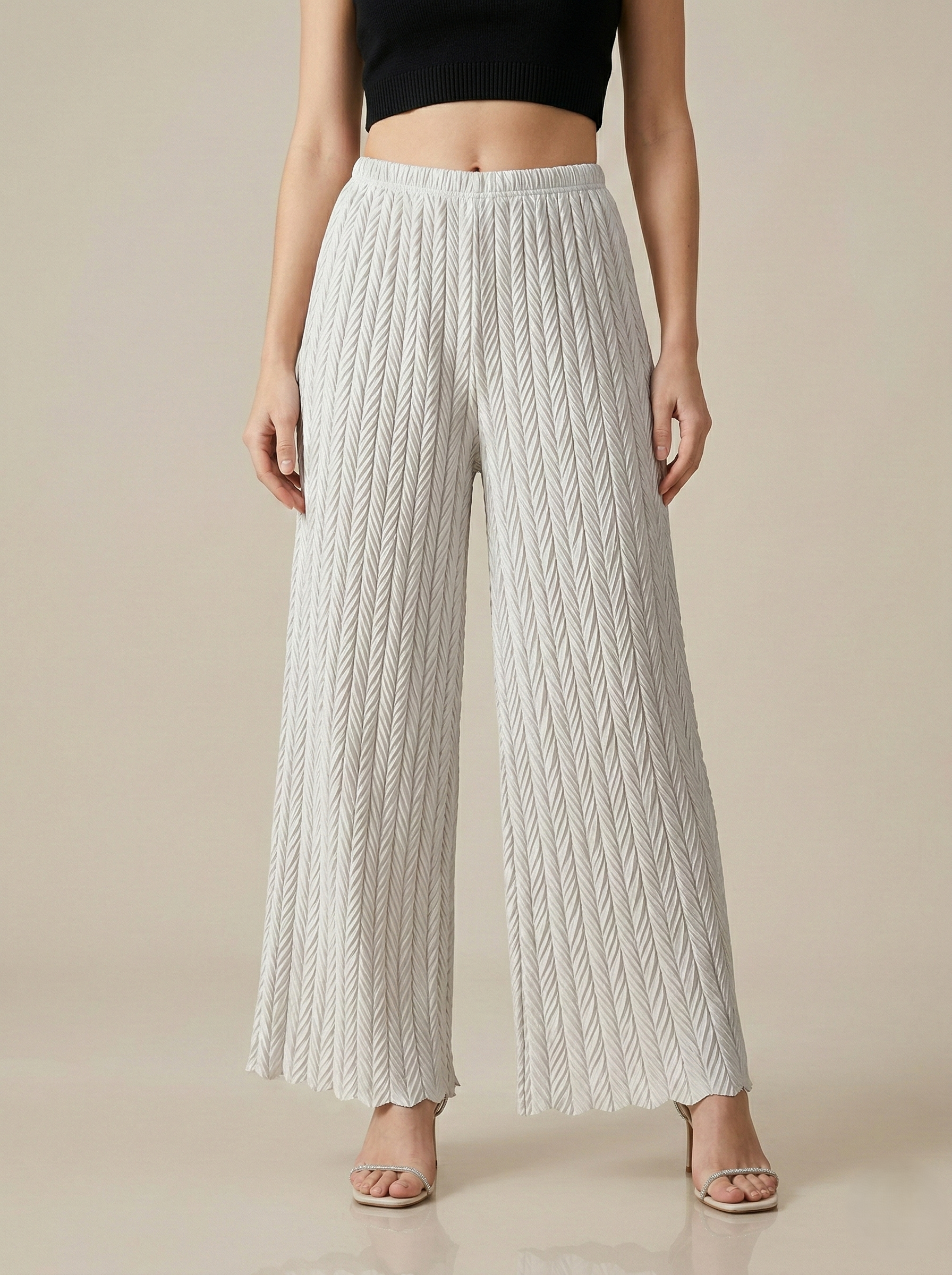Textured pleated palazzo pants for women by Apricot Dione, showing the wide-leg, flowy fabric with a comfortable fit.