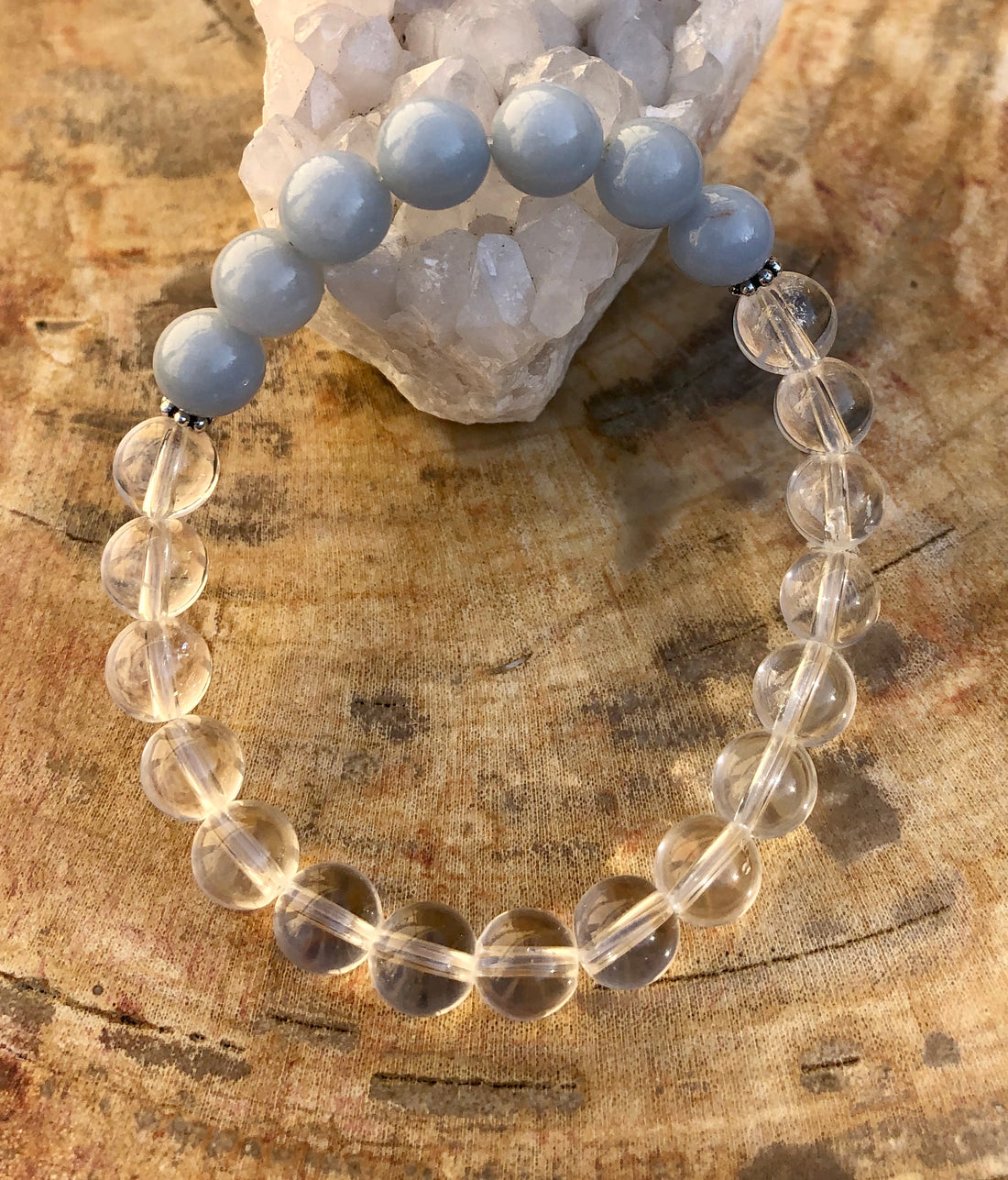 Angelite, celestite, and crystal quartz gemstone bracelet by Violet Chaos featuring genuine colorful beads and a delicate elastic band.