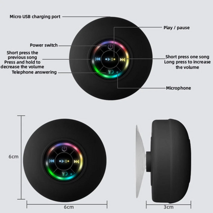 Lilac Milo mini portable waterproof RGB Bluetooth speaker with suction cup, shown on a flat surface with colorful LED lights.