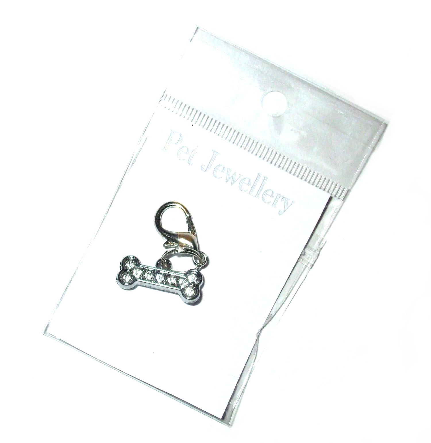 Small bone pendant charm for pet leashes and collars by Salmon Oscar, featuring a detailed bone design.
