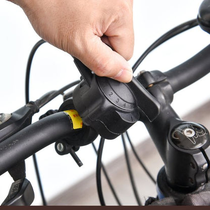 Indoor magnetic bike trainer stand by Taupe Shadow with five resistance levels, showing the bike mount and control dials.