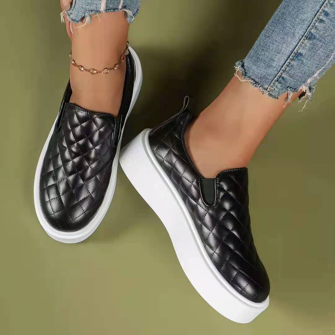 Black and white lightweight slip-on platform loafers by Coffee Jasper, casual flats with a comfortable, stylish design.