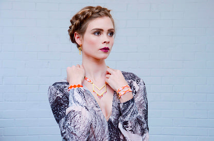 Yellow Athena Twilight Bracelet featuring pink, orange, blue beads with gold accents, stylish jewelry for everyday wear.