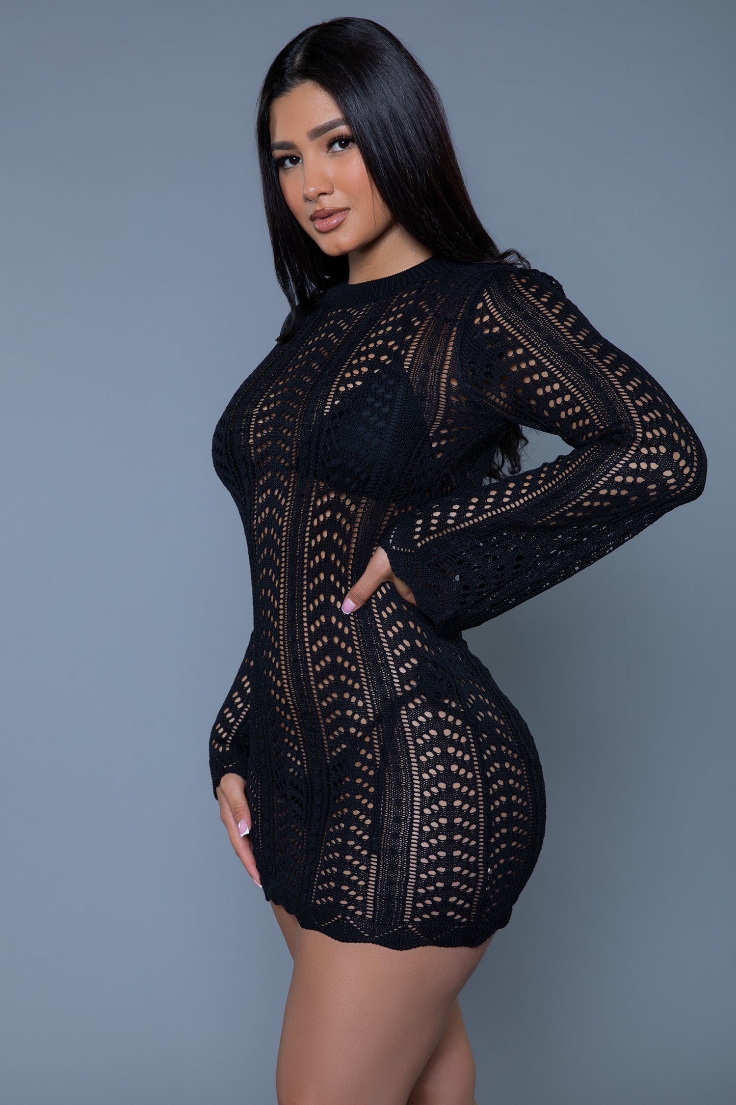 Magenta Caeneus Kinsley Crochet Mini Dress featuring a fitted silhouette, intricate crochet pattern, and sleeveless design.