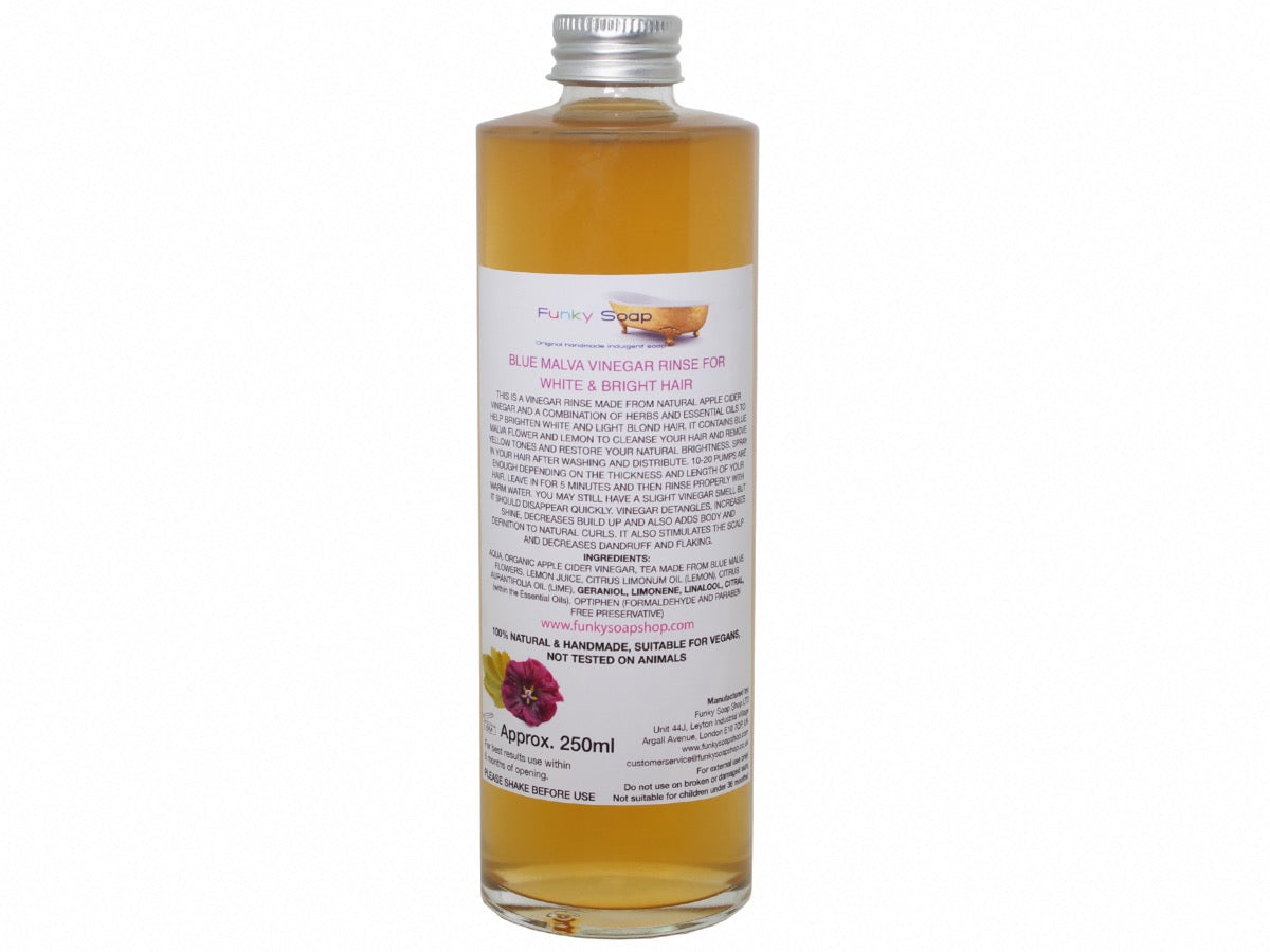 Tan Abderus white vinegar rinse for hair in a glass bottle, natural handmade haircare product for white or gray hair.