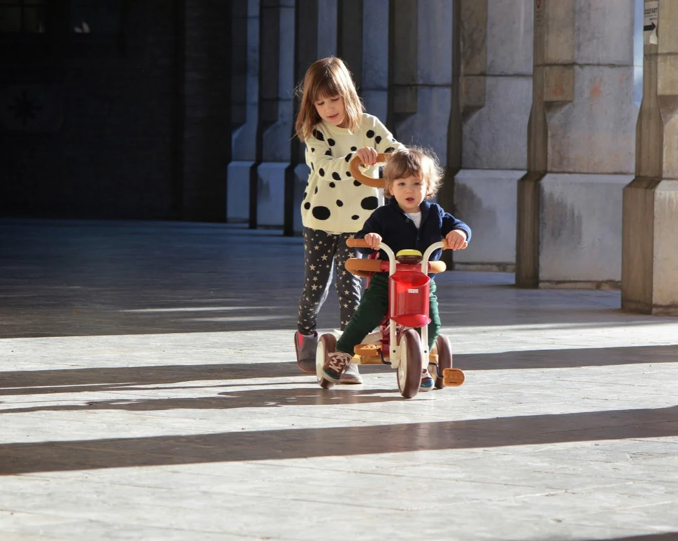 Taupe Pear Evolutive Tricycle for biking, featuring a sturdy frame, comfortable seat, and adjustable features for young riders.