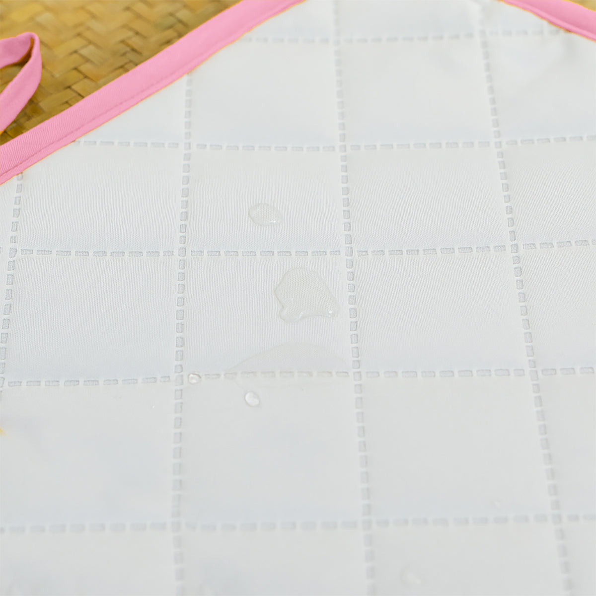Pink Nomadic Changing Mat for kids and babies by Chocolate Briseis, featuring a soft, portable design with colorful patterns.