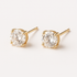 Gold-colored brass round zirconia earrings by Apricot Perses, cadmium and lead-free, showcasing sparkling gemstone details.